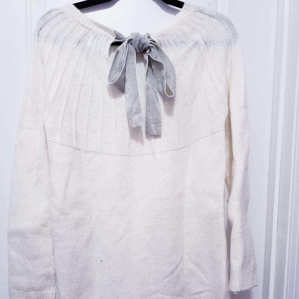 Creamy white sweater dress with grey suede bow